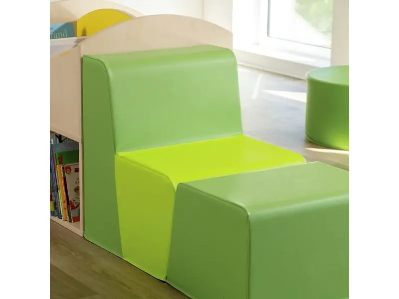 green soft-foam chair folded flat for use as a cushion or extended seating during group activities