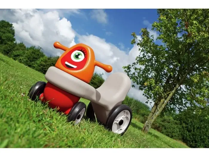 First Ride-On Set Dynamo Pushalong orange toddler ride-on encouraging coordination, movement, and independent play.