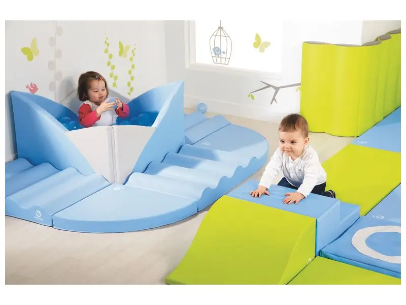Lotus Wall Ball Pool blue soft foam ball pool designed with curved petal walls for toddlers to develop balance, coordination, and sensory awareness.