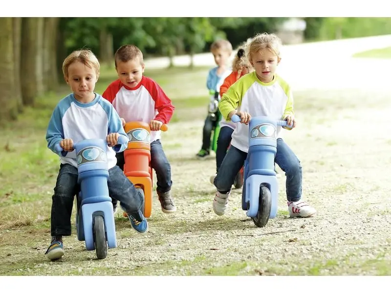 Motorcycle ride-on set of colourful toddler bikes promoting balance, steering control, and cooperative movement.