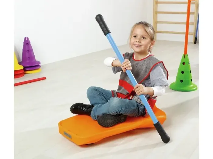 Ovi’Slide Complete Kit compact sit-on board with integrated rollers, rope, and paddle for core stability work.