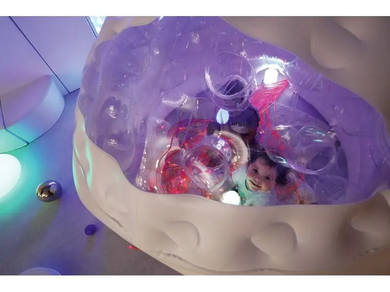 enclosed inflatable structure promoting balance between stimulation and calm for sensory comfort