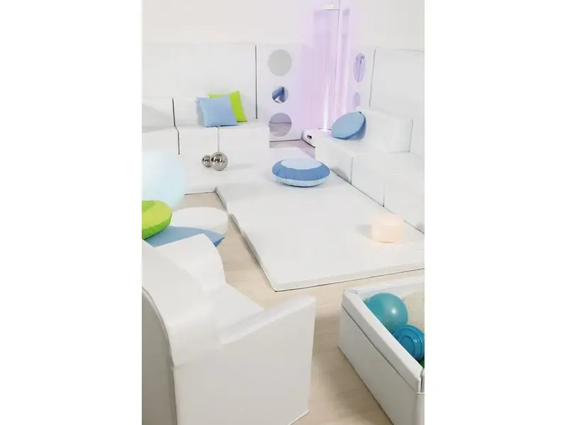 open sensory play area featuring calming colours and soft modular furniture for creative movement and rest