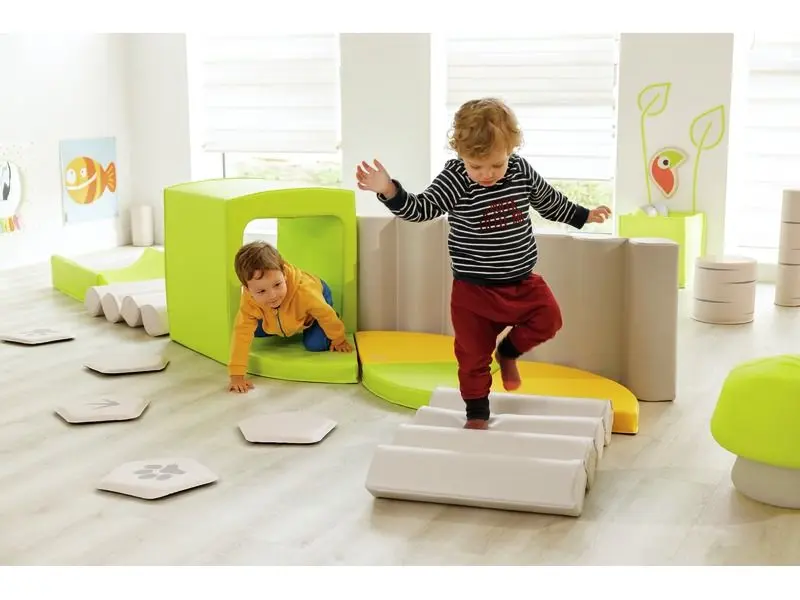 green foam tunnel promoting adventure, balance, and self-confidence during early gross-motor play