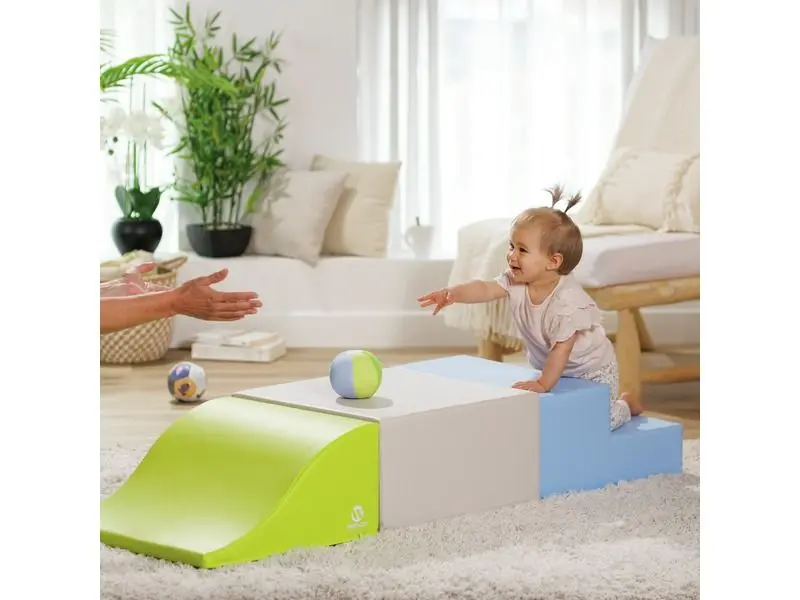 modular foam passageway with gentle steps and a low slide supporting safe gross motor development and confident exploration