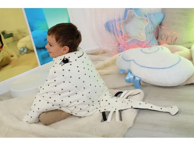 plush weighted manta ray encouraging grounding, body awareness, and secure rest