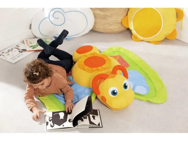 large butterfly-shaped floor cushion with soft curved wings creating a cozy place for rest or group play